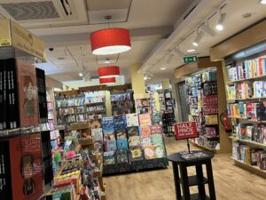 VIew of the children's section of a bookshop. It looks colourful and inviting.