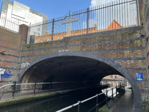 Bridge over the canal with a sign saying "Black Sabbath Bridge"